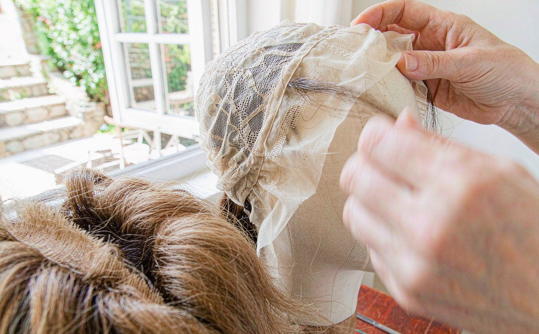 Hand-tying lace in our workshop