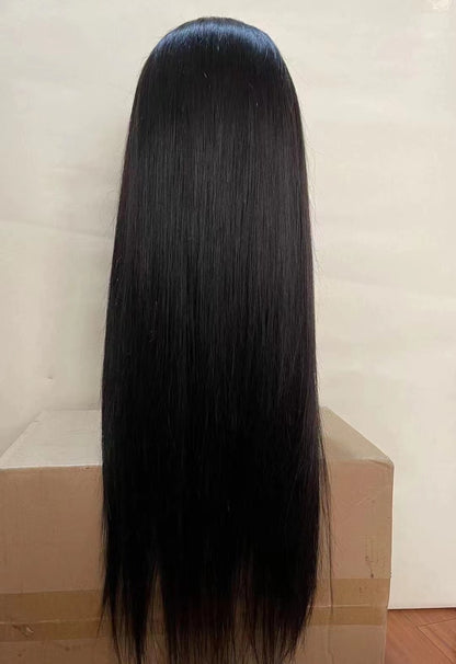 Straight 4x4 Closure Wig - 180%/210% Density, Natural Black - back view of the straight closure wig on a cardboard box