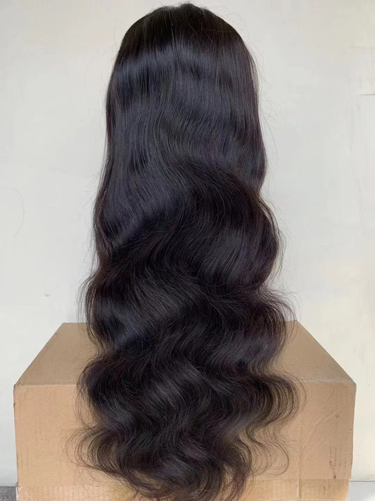 Body Wave 13x4 Lace Front Wig - 180%/210% Density, Natural Black - back view of the body wave wig resting on a cardboard box, showing the wave pattern and length