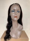 Body Wave 13x4 Lace Front Wig - 180%/210% Density, Natural Black - back view of the long body wave wig on a cardboard box showing loose waves